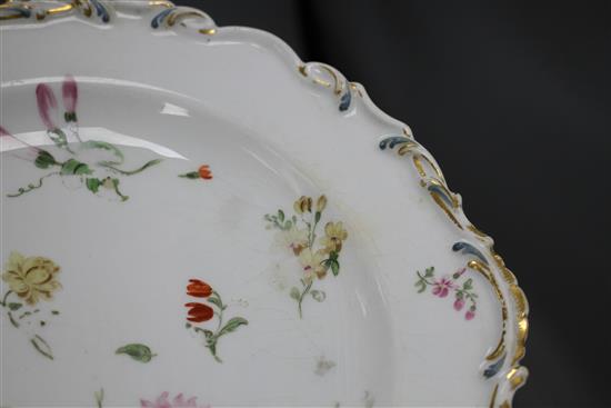 A Chelsea gold anchor bird and insect plate and a similar pair of floral plates, c. 1765, 22 and 23cm